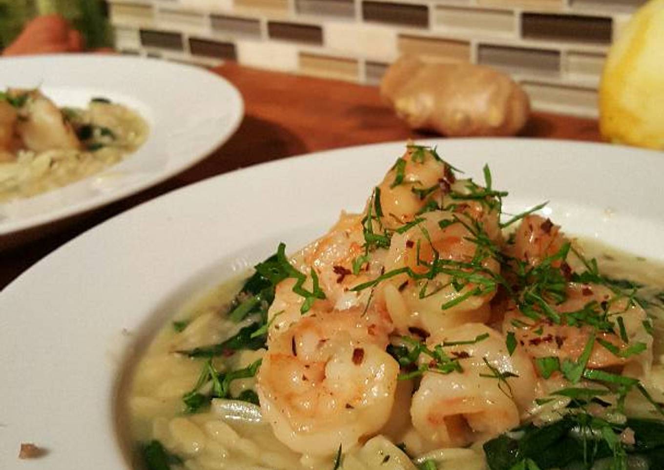 Butter poached shrimp with parmasan spinach orzo risotto