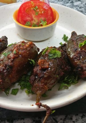 A picture of Stuffed Brinjal in tamarind spices.