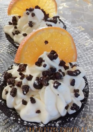 A picture of Chocolate Tartlets with Clementine Mousse.