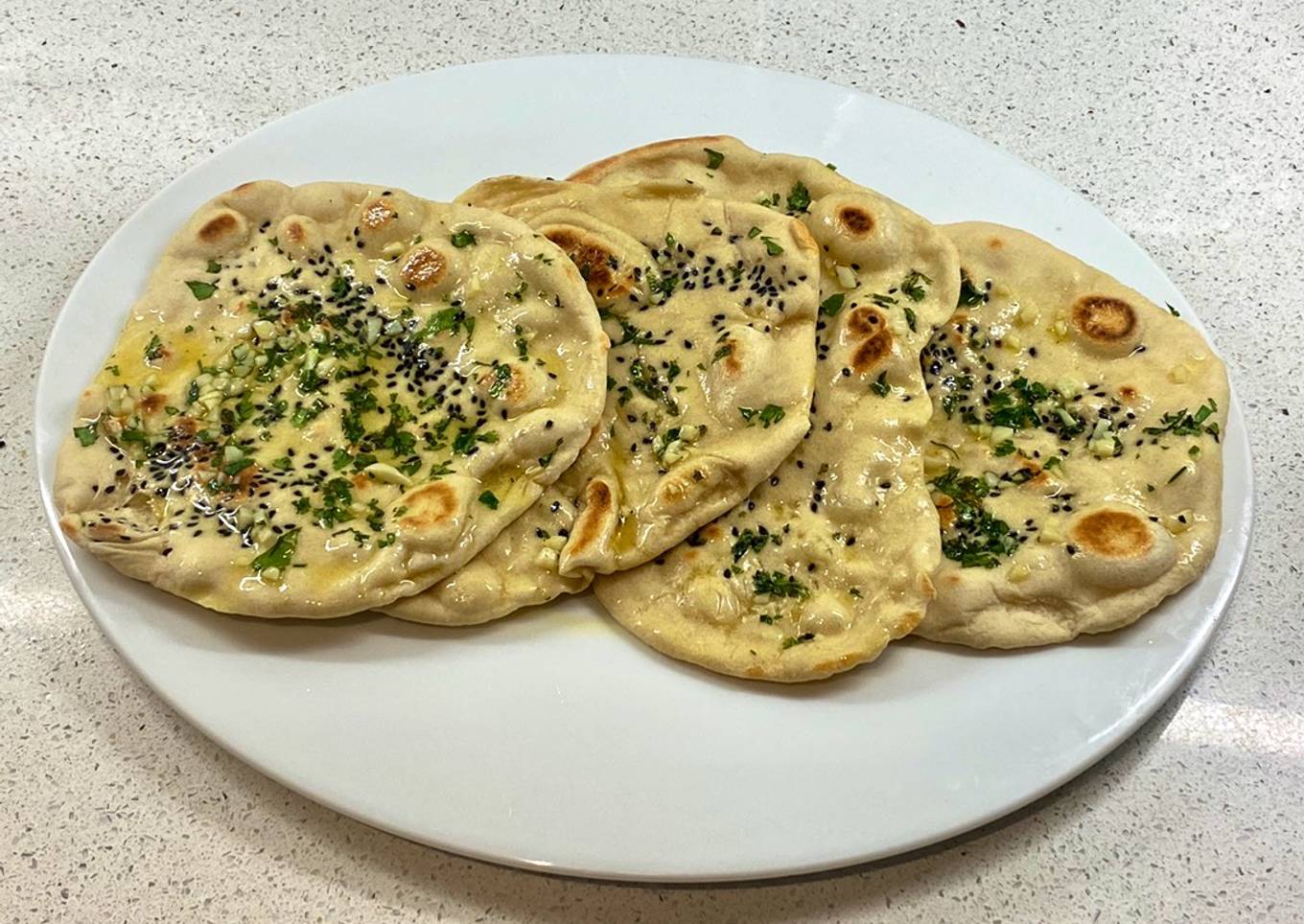 Onion seeds, garlic, parsley and butter naan