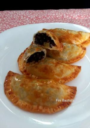 Una foto de Empanadillas de morcilla de arroz y manzana