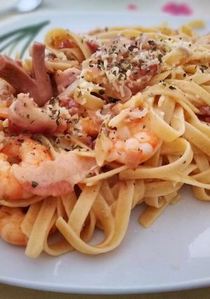A picture of Shrimp Fettucine with bacon and sausage carbonara.