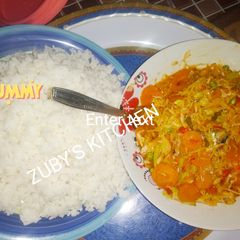 A picture of Rice with vegetables souce.