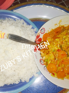 A picture of Rice with vegetables souce.
