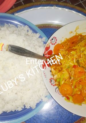 A picture of Rice with vegetables souce.
