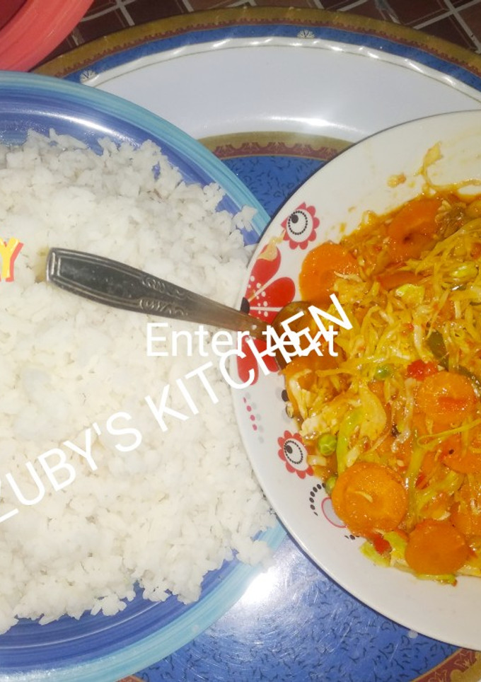 A picture of Rice with vegetables souce.