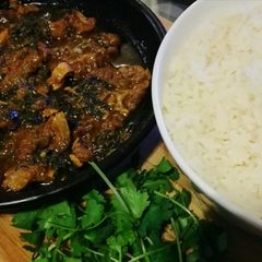A picture of Lamb and spinach curry.