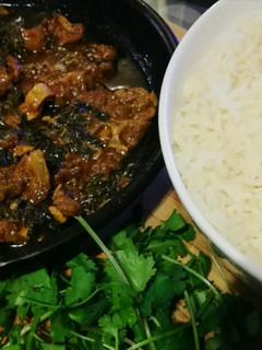 A picture of Lamb and spinach curry.
