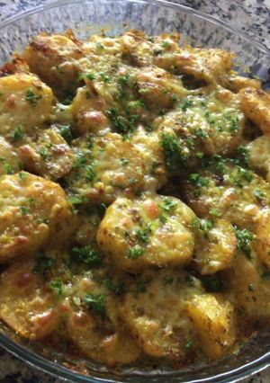 Una foto de Papas al horno con ajo y perejil a la Rosita
