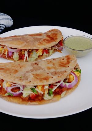 A picture of Paneer tikka paratha tacos.