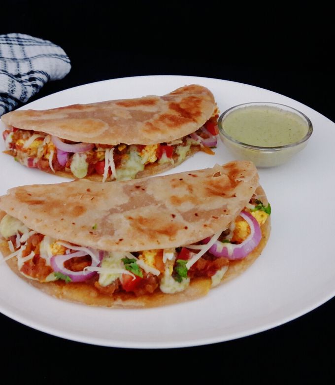 A picture of Paneer tikka paratha tacos.