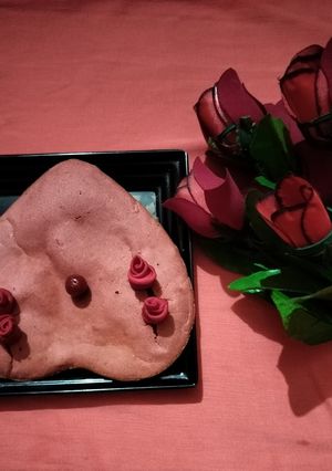 A picture of Eggless heart shape red velvet cake.