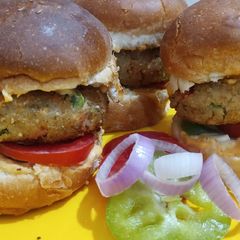 A picture of Crispy Veg Tikki Burger Recipe/VegTikki Cheese Burger.