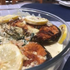 A picture of Pan fried Salmon with creamy sauce.