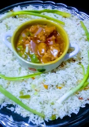 A picture of Chicken chilli with stir fry veg rice.