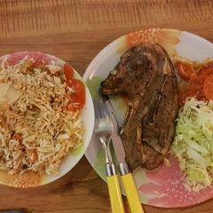 Panfried steak served with fried rice and veges A picture of Panfried steak served with fried rice and veges.