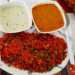 A picture of Dosa fry with sambar chutney.