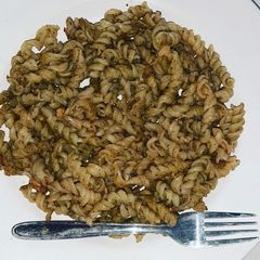 A picture of Pasta with green dip.