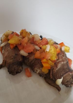 A picture of Brad's steak roll up's with heirloom tomato relish.