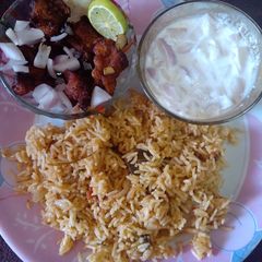 A picture of Biriyani Style Veg Pulao with Chicken 65.