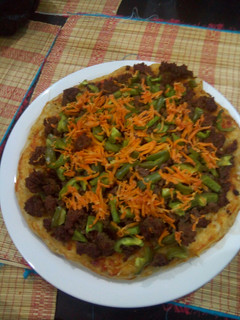 A picture of My cheeseless Pizza.