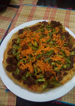A picture of My cheeseless Pizza.