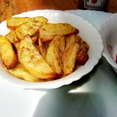 A picture of Baked potato wedges.