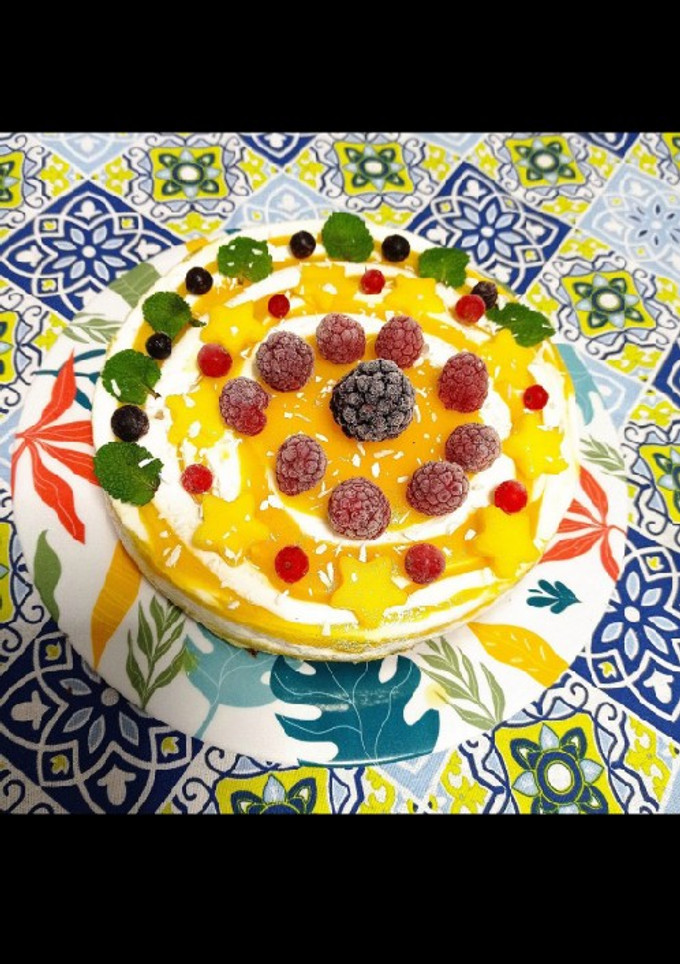 Una foto de Cheesecake cebra 🦓 de mango 🥭 y coco 🥥