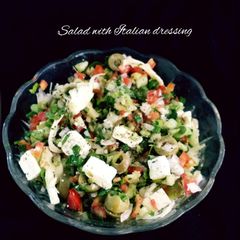 A picture of Salad with Italian dressing.
