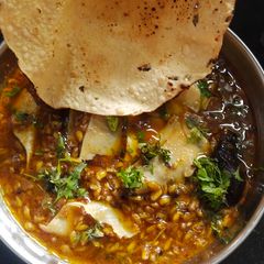 A picture of Methi fenugreek seeds and papad sabji.