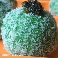A picture of Paan coconut laddus filled with gulkand.