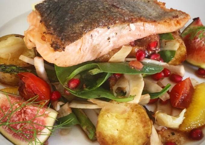 Seared salmon on figs, roasted potatoes, fennel spinach and pomegranate dressing