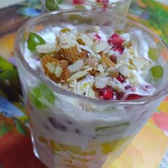 A picture of Creamy fruits and nuts delight.