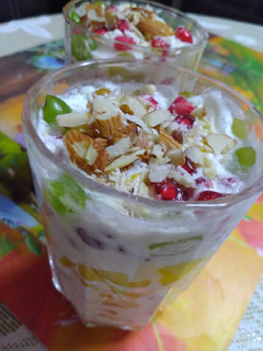 A picture of Creamy fruits and nuts delight.