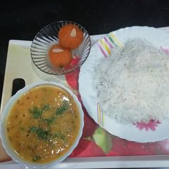 A picture of Dal tadka and rice.
