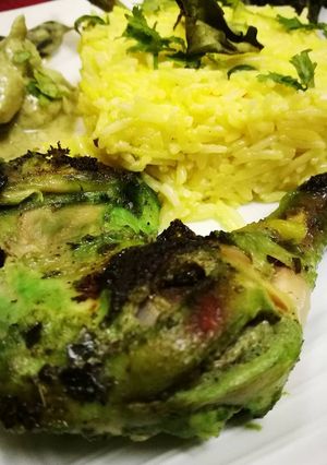 A picture of Green chicken tikka thai chicken curry garlic rice.