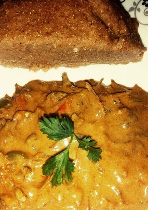 A picture of Omena cooked in coconut milk served with brown ugali.
