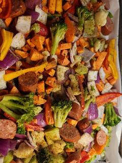 A picture of Kielbasa and vegetable sheet pan dinner.