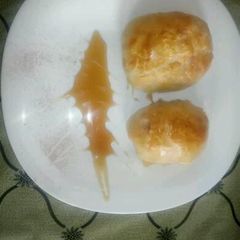 A picture of Egg wrapped in sausage and puff.