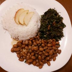 Rice served with beans and spinach A picture of Rice served with beans and spinach.