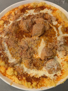 Una foto de Polenta con Estofado de Pollo