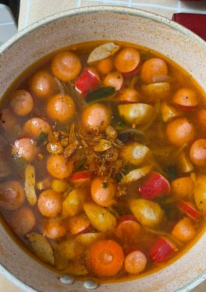 A picture of Red Tomato Soup with Sausage, Meatballs, Carrots, and Potatoes.