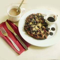 A picture of Cranberry Blueberry Waffles  with Chocolate Sauce.