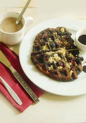 A picture of Cranberry Blueberry Waffles with Chocolate Sauce.