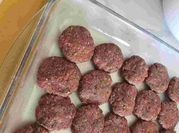 A picture of kofta with potato and tomato