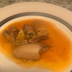 A picture of Calamari in tomato sauce.