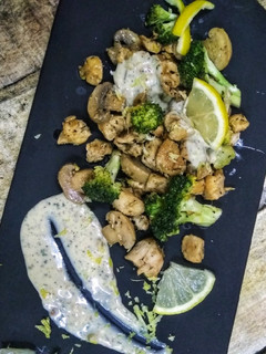 A picture of Lemon chicken, broccli and mushroom with double cheese sauce.