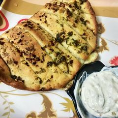 A picture of Stuffed cheesy garlic bread.