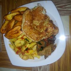 A picture of Arish potatoes with egg, pepper soup and plantain.
