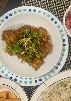A picture of Chicken masala with peas pulao rice.